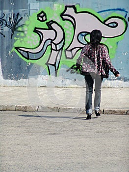 Girl with grafitti wall