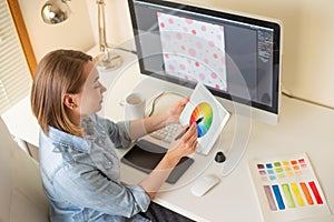 Girl graphic web designer. working on a project. work with color. freelance designer