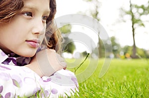Girl on grass in park.