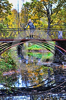 Girl in a gray coat in autumn park