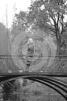 Girl in a gray coat in autumn park