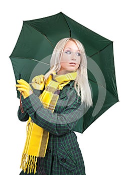 Girl in green coat with umbrella
