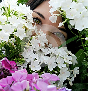 Girl with green eyes in flowers photo