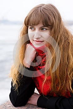 Girl with green eyes in the red scarf