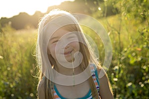 Girl on green field