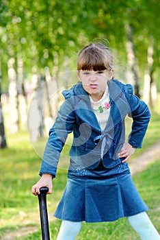 Girl among green grass