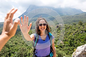 Girl greets friend, The girl gives five, Gesture of greeting