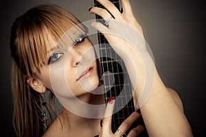 Girl with a guitar fretboard