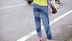 Girl with a guitar hitch-hiking