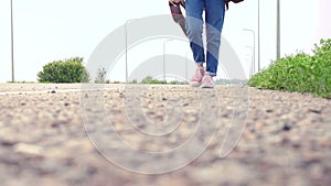 Girl with a guitar hitch-hiking