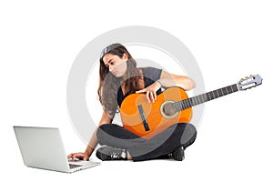 Girl with a guitar and laptop