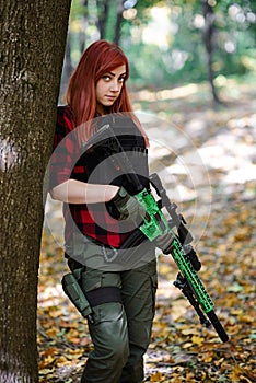 Girl with gun looks frown