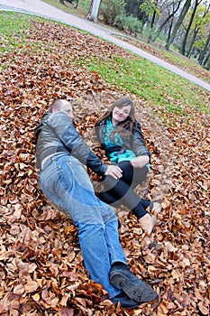 Girl and guy on the leaves