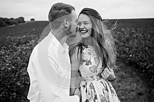 A girl and a guy are walking in the nature. Portrait of a couple, a love story.Happy smiling, loveing couple together outstretched