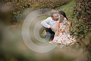 A girl and a guy are walking in the nature. Portrait of a couple, a love story.Happy smiling, loveing couple together outstretched