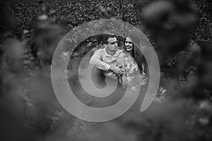 A girl and a guy are walking in the nature. Portrait of a couple, a love story.Happy smiling, loveing couple together outstretched