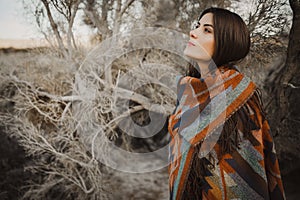 Girl in gypsy look in desert nature