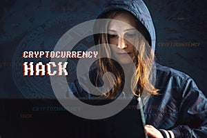 Girl hacker with a face is trying to steal cryptocurrency using a computer. Fraud and scam at Cryptojacking