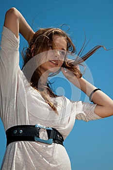 Girl with hair fluttering in the wind