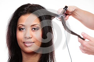 Girl hairdo with electric hair curler