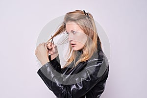 Girl hairdresser. To myself. Black jacket. White background