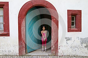 Girl in Half timbered house in a village in Alsace