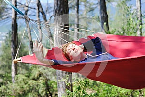 Girl in a hammock, woods