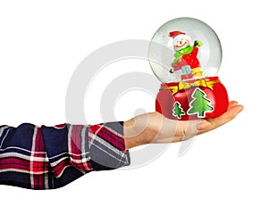 Girl hand holding christmas crystal ball