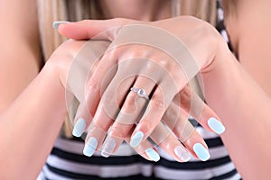 Elegance and Bliss: Blue Manicure and Diamond Rings photo