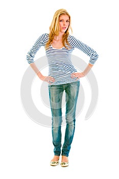 Girl with hands on hips attentively looking