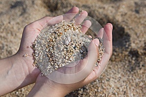 Girl hands with little stones