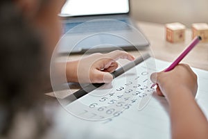 Girl hands, math and writing on paper, counting and homework with number, elearning and laptop in home. Child, learning