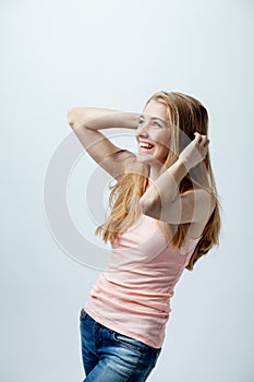 Girl with hands over head