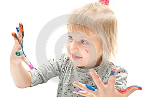 Girl with hands in paint