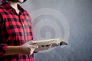 Girl hands while reading the Bible