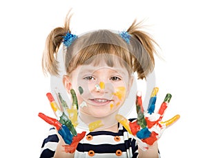 Girl with hands soiled in a paint.