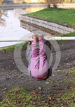 Girl hanging on banisters