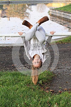 Girl hanging on banisters