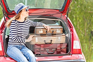 Girl happy child travel suitcases car summer landscape