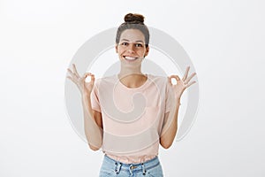 Girl happy finally everything okay posing relieved and joyful standing carefree over grey wall with orbs, showing ok