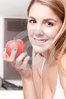 Girl happy relaxed with an apple