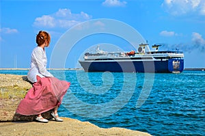 Girl in harbor looking at cruise ship leaving the dock of the bay - sea landscape