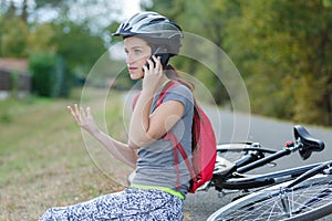 Girl that has bike accident calling on phone