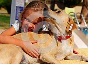 Girl has fun playing with dog in the park