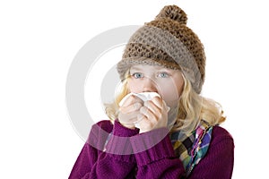 Girl has sniff and blow her nose with a tissue photo