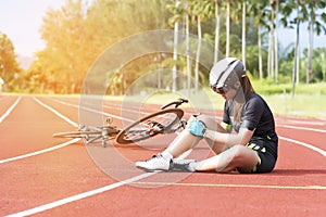 Girl has sport accident injury at her knee from bicycle, Sport and Accident concept