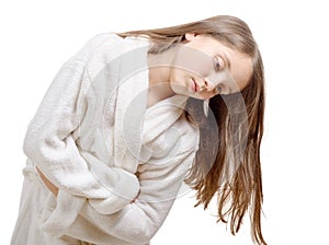 Girl has a stomachache with bathrobe, on white backgrou