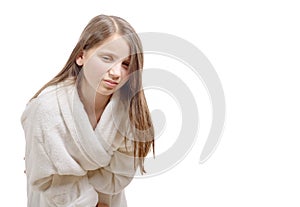Girl has a stomachache with bathrobe, on white backgrou
