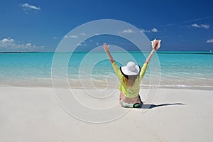 Girl in the hat on the beach