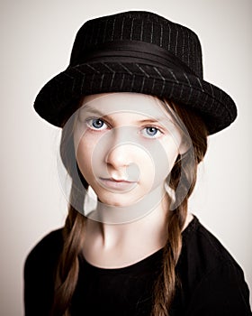 Girl with hat and plaits photo